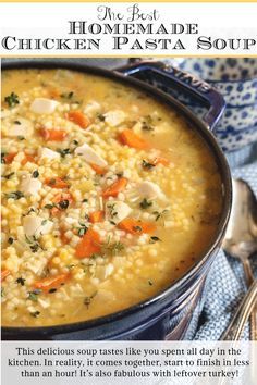 a bowl of soup with carrots, chicken and parsley