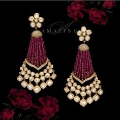 Silver Moissanite Polki Earring | Indian Wedding Jewelry | Indian Moissanite Polki Earring| Statement Earring Material : Silver Gemstone: Moissanite, Hydro Ruby Beads, Swarovski Stones Stone colour: Uncut Polki Primary colour: Gold Size-Length: 75mm Width: 50mm Closure : Screw back and Clips Silver Intricate, hand crafted, Pure Silver Polki Earrings, studded with high quality Moissanite and Fresh Water Sea Pearls Earring comes with screw back and clips, made in 92.5 silver with 22ct gold plating Luxury Meenakari Bridal Drop Earrings, Luxury Ruby Earrings With Latkans, Elegant Chandelier Earrings With Latkans For Reception, Elegant Chandelier Earrings For Reception And Festivals, Luxury Earrings For Festivals, Elegant Jewelry With Dangling Beads For Reception, Elegant Reception Jewelry With Dangling Beads, Traditional Gemstone Chandelier Earrings For Weddings, Traditional Diamond Chandelier Earrings For Celebrations