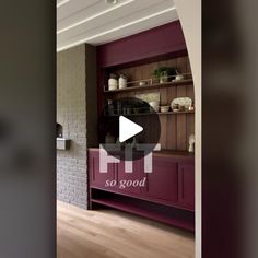 an image of a kitchen with purple cabinets and wood flooring in the living room