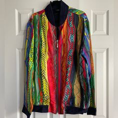 Coogi Silk Bomber Jacket Men’s Size Xl Beautiful Men’s Jacket, Pattern Is Vibrant And The Navy Sweater Cuffs Make It The Perfectly Wearable Spring Or Fall Statement Piece Nwot Never Worn, No Longer Available/In Stock 100% Silk Casual Multicolor Track Jacket For Fall, Multicolor Long Sleeve Track Jacket For Spring, Multicolor Long Sleeve Patchwork Track Jacket, Vibrant Multicolor Long Sleeve Outerwear, Multicolor Long Sleeve Winter Track Jacket, Casual Multicolor Long Sleeve Track Jacket, Navy Sweaters, Red Yellow, Mens Jackets