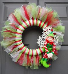 a christmas wreath with an elf on it