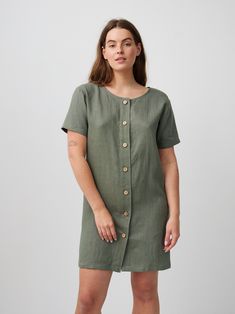 "LYRA is a simple short sleeve linen mini button down dress. It may well be the easiest dress ever. DETAILS - Mini length - Short sleeve - Boat neckline - Coconut buttons - Pockets available upon request - Oeko-Tex certified 100% lightweight linen - Cut and sewn to order just for you in our studio COLOR - Sage Green, you can also choose other colors above - Fabric samples are available here https://www.etsy.com/listing/586569696/linen-fabric-samples SIZING & FIT - Fits true to size - - Model is 5'6\" / 172 cm and wearing a size M CARE FOR LINEN - Machine wash up to 30ºC/86ºF gentle cycle - Lay flat to dry or tumble dry low - Warm iron if needed - Do not bleach SIZE GUIDE Size conversion guide Size XS (US 0-2, IT 36-38, UK 4-6, Japan 3-5, France 32-34) Size S (US 4-6, IT 40-42, UK 8-10, Jap Linen Button Down Dress, Black Linen Dress, Studio Color, Navy Blue Linen, Linen Mini Dress, Dress Linen, Linen Short, Linen Jacket, Button Down Dress