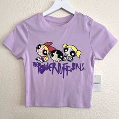 Forever 21 The Powerpuff Girls Graphic Tee Size Small Light Purple Lavender Lilac Graffiti Print Logo Blossom Bubbles And Buttercup Short Sleeve Crew Neck Semi Cropped Super Soft Powerpuff Girls Merch Is Hard To Find. Grab This Exclusive T-Shirt And Soak Up The Nostalgia Of Vintage Y2k Cartoon Network Brand New With Tags Make Me An Offer Trendy Purple Tops With Letter Print, Y2k Purple Short Sleeve Tops, Purple Y2k Short Sleeve Tops, Purple Short Sleeve Y2k Top, Purple Short Sleeve Y2k Style Tops, Purple Y2k Crew Neck Top, Purple Crew Neck Top With Cartoon Print, Y2k Purple Graphic Print Top, Purple Cartoon Print Tops For Spring