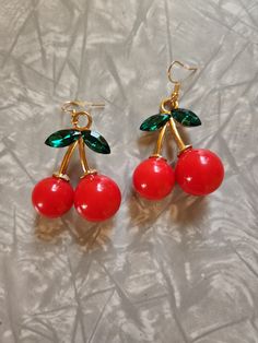 Fun big red cherry Charm Earrings. This is for 1 pair of earrings. These are on a French hook earring. If you love Fun, colorful, food earrings, then these are for you. Or wear them to a 80's themed party. Also would make a Fun gift to give to someone.  If you have any questions please feel free to contact me.  Thank you for shopping at my store. Have a Totally Awesome Day! 😎 Cherry Colored Earrings For Valentine's Day Gift, Cherry Color Earrings For Valentine's Day Gift, Cherry Earrings For Valentine's Day Gift, Cherry Colored Round Earrings For Gift, Cherry Round Earrings For Gift, Retro Red Dangle Earrings, Cherry Dangle Earrings For Party, Sweet Red Drop Earrings, Cherry Color Dangle Earrings For Party