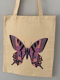 "Hand painted, canvas tote bag. Approximately 13\"X15.5\" with 12\" handle drop. Purple Butterfly design." Artsy Hand Painted Tote Canvas Bag, Artsy Hand Painted Canvas Tote Bag, Cotton Hand-painted Bags For Daily Use, Hand Painted Cotton Tote Canvas Bag, Hand Painted White Canvas Bag, Hand-painted White Canvas Bag, White Hand Painted Canvas Bag, Daily Use Hand Painted Canvas Bags, Hand Painted Canvas Tote Bag