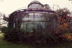 an old round building with vines growing around it