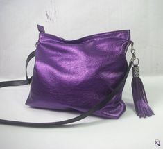 SOFT METALLIC PURPLE leather Purse bag with Leather Tassel HANDMADE in Australia * Bag opens all the way across the top * 2 inside pockets including zipper pocket * 1 outside zipper pocket * Strong metal zip closure with leather zipper pull * Quality strong hardware * Riveted black Metallic Leather Bag, Purple Purse, Purple Bag, Metallic Purse, Purple Love, Metallic Bag, Tassel Bag, Leather Bags Handmade, Purple Leather