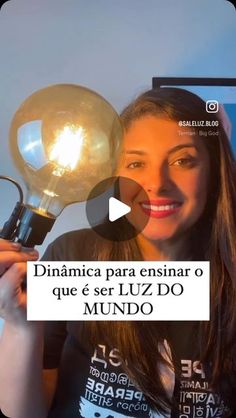 a woman holding up a light bulb in front of her face with the caption