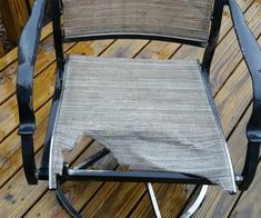 a chair that is sitting on top of a wooden deck with no one around it