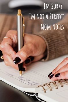 a woman's hand writing on a notebook with the words i'm sorry, i'm not a perfect mom notes