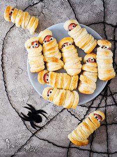 there are many croissants with eyes on them and one has a spider