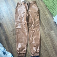 Brown Leather Pants Brand New With Tags Size 6 (Us) Trendy Brown Leather Pants With Pockets, Fitted Brown Utility Bottoms, Brown Fitted Utility Pants, Brown Fitted Utility Cargo Pants, Fitted Brown Utility Cargo Pants, Fitted Brown Cargo Pants, Brown High-waisted Leather Pants With Pockets, High-waisted Brown Cargo Pants With Belt Loops, Trendy Fitted Brown Cargo Pants