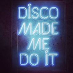 a neon sign that says disco made me do it