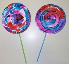 two paper plates with colorful designs on them