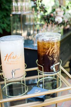 two drinks sitting on top of a glass table