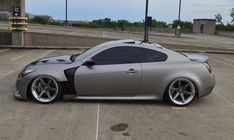 a silver sports car parked in a parking lot