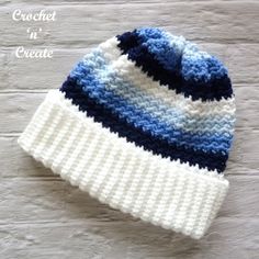 a crocheted hat with blue and white stripes