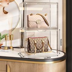 three clear acrylic shelves with purses and handbags on them in front of a mirror