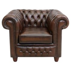 a brown leather chair with buttons on it