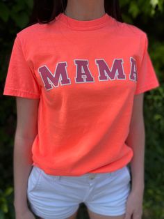 Calling all mama's!! You can totally make a statement in this tee! The neon orange color against the pink is the perf color combo, especially in the Summer against a tan!! Comfort Colors: Neon Red Orange Professionally Screen Printed 100% Cotton Unisex: True To Size Fit model is wearing a size small, her true size. Casual Neon T-shirt With Screen Print, Pink Crew Neck T-shirt For Game Day, Spring Game Day T-shirt With Text Print, Spring Game Day Top With Text Print, Casual Orange Tops For Game Day, Summer Pink T-shirt With Name Print, Pink Graphic Tee For College, Pink T-shirt With Name Print For Summer, Summer Orange Tops With Slogan