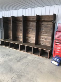 an empty storage area with several wooden shelves