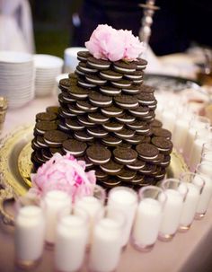 a cake made out of cookies and pink flowers