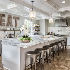 a kitchen filled with lots of counter top space next to an oven and refrigerator freezer