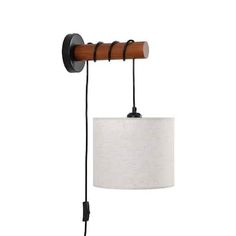 a wall light with a white shade hanging from it's side and a wooden arm