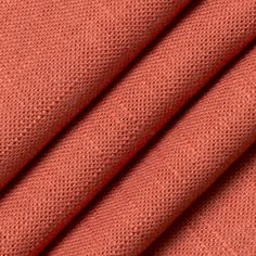 an orange fabric textured with small dots on the outside and inside, as well as in