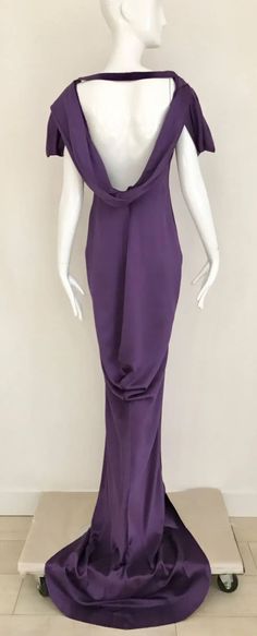 For Sale on 1stdibs - Stunning Alexander McQueen Purple violet silk charmeuse gown with interesting sleeves and exposed bare back. Slightly cowl neck. strap can be removed. Alexander Mcqueen Silk Dress, Pre-draped Floor-length Silk Dress For Gala, Pre-draped Silk Evening Dress, Pre-draped Floor-length Silk Evening Dress, Pre-draped Cowl Back Maxi Dress For Evening, Bias Cut Draped Fitted Gown, Fitted Bias Cut Draped Gown, Silk Evening Dress With Draped Sleeves, Pre-draped Silk Maxi Dress For Evening