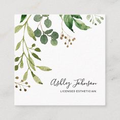 a business card with watercolor leaves and berries