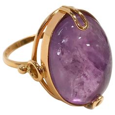 14 Karat Russian Rose Gold Amethyst Ring. The ring features a bezel-set 15.0ct oval cabochon Amethyst. The handmade ring also contains custom looped prongs and a simple wire detail that is attached to the bezel and band. Stamped on the inside of the band is 7RK P 583 with the hammer & sickle icon inside the star (see last two photos). The ring size is 6 and the ring has a gold weight of 5.8 grams. Luxury Amethyst Cabochon Ring For Formal Occasions, Luxury Oval Amethyst Ring With Polished Finish, Luxury Polished Oval Amethyst Ring, Luxury Formal Cabochon Amethyst Ring, Luxury Formal Amethyst Cabochon Ring, Luxury Yellow Gold Amethyst Ring Oval Cabochon, Luxury Round Cabochon Amethyst Ring, Luxury Amethyst Cabochon Ring, Formal Amethyst Oval Cabochon Jewelry