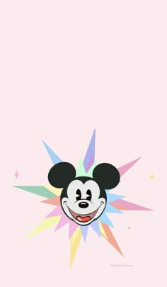 mickey mouse face with colorful stars in the background on a pink wallpapered surface