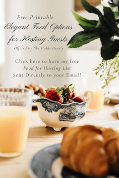 a table topped with croissants and fruit next to a glass of orange juice