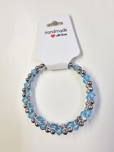 Elevate your style with our stunning light blue and silver wrap bracelet, a perfect accessory for women who appreciate unique jewelry. This boho-inspired leather bracelet features beautiful gemstones and seed beads in shades of light blue, creating a chic and elegant look. The addition of silver beads adds a touch of sophistication to this eye-catching piece. Whether you're dressing up for a special occasion or simply want to add a pop of color to your everyday outfit, this memory wire bracelet is versatile and easy to wear. Make a fashion statement with this beaded leather wrap that combines crystal elements with sapphire accents for a one-of-a-kind bracelet that will surely turn heads. Light Blue Adjustable Crystal Bracelet, Adjustable Light Blue Crystal Bracelet, Adjustable Light Blue Bracelets With Faceted Beads, Light Blue Adjustable Bracelet With Faceted Beads, Adjustable Light Blue Bracelet With Faceted Beads, Adjustable Light Blue Crystal Bracelet With Round Beads, Adjustable Light Blue Crystal Bracelet For Gift, Blue Friendship Bracelets With Faceted Beads For Gift, Blue Faceted Beads Friendship Bracelets As Gift