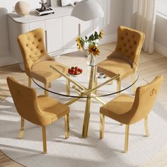 a glass table with four chairs around it