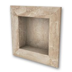 an empty stone niche with no one in the room or on the floor, it is made out of marble