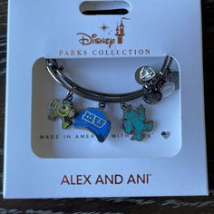 Very Cute Monsters University Bracelet There Are Two Bracelets In The Packaging Blue Friendship Bracelets With Charms, Monster Ink, Adjustable Silver Bracelet, Snowflake Bracelet, Alex And Ani Bangles, Disney Bracelet, Cupcake Charms, Monsters University, Adjustable Bangle Bracelet