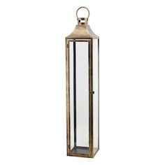 a tall glass and metal lantern on a white background