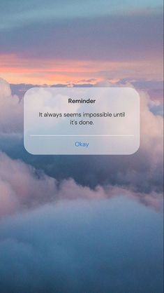 the text reads reminder it always seems impossible until it's done on top of clouds