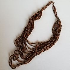 Boho Brown Seed Bead Necklace Condition: Nwot Measurement. Length: 16-20" This Fashion Necklace Is Not Meant To Be Worn In The Water Or While Exercising No Trades | Open To All Offers | Feel Free To Ask Any Questions | Thank You For Shopping My Closet Brown Multi-strand Necklace With Polished Beads, Beaded Brown Necklaces, Brown Multi-strand Beaded Necklaces, Bohemian Brown Beaded Necklaces With Faceted Beads, Bohemian Brown Beaded Necklace With Faceted Beads, Brown Polished Beads For Beach, Brown Multi-strand Necklace With Colorful Beads, Brown Multi-strand Beaded Necklace For Gift, Beach Necklace With Brown Round Beads