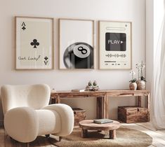 a living room filled with furniture and pictures on the wall