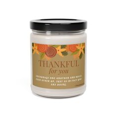 a white jar with a black lid that says, thank for you on the front