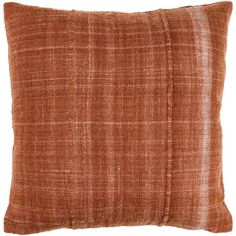 an orange pillow with a brown checkered pattern on the front and back, sitting on a white background