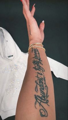 a woman's arm with writing on it