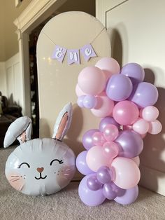 a bunny balloon and some balloons on the floor