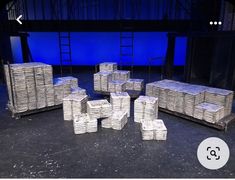 a bunch of boxes sitting on top of a stage in front of a blue screen