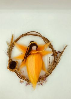 an image of a doll in the middle of some dried grass and flowers on a white background