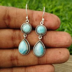 NOTE : WE USED NATURAL GEMSTONES , SO STONE  MAY BE LITTLE DIFFERENT .Here is a listing of Larimar 925-Sterling Silver Earrings About Product :- # Title - Silver Bezel Earrings # Material - Sterling Silver 925 # Stone - Larimar Gemstone# Shape - Round & Pearit will look very beautiful when you wear in party and special occasion ..It is A special gift for your loved once ...Note -Please see all images for more details . Thanks for visiting our shop. Favorite our shop for daily updates .. Larimar Round Beads Jewelry For Gifts, Round Larimar Gemstone Beads Jewelry, Spiritual Round Larimar Jewelry, Elegant Larimar Cabochon Jewelry, Blue Larimar Dangle Earrings, Larimar Earrings, Bezel Jewelry, Bezel Earrings, Rainbow Moonstone Ring