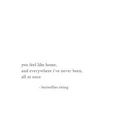 the words are written in black and white on a paper sheet that says you feel like home, and everywhere i've never been, all at once - butterflies rising